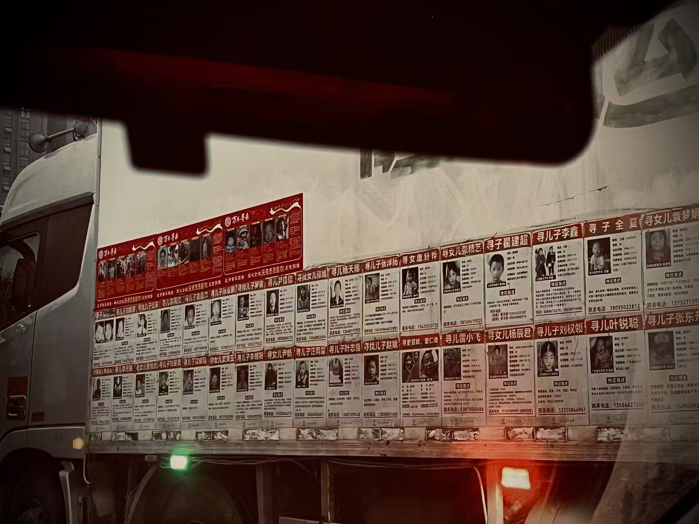 Heart adorned Missing Person Notice on Truck